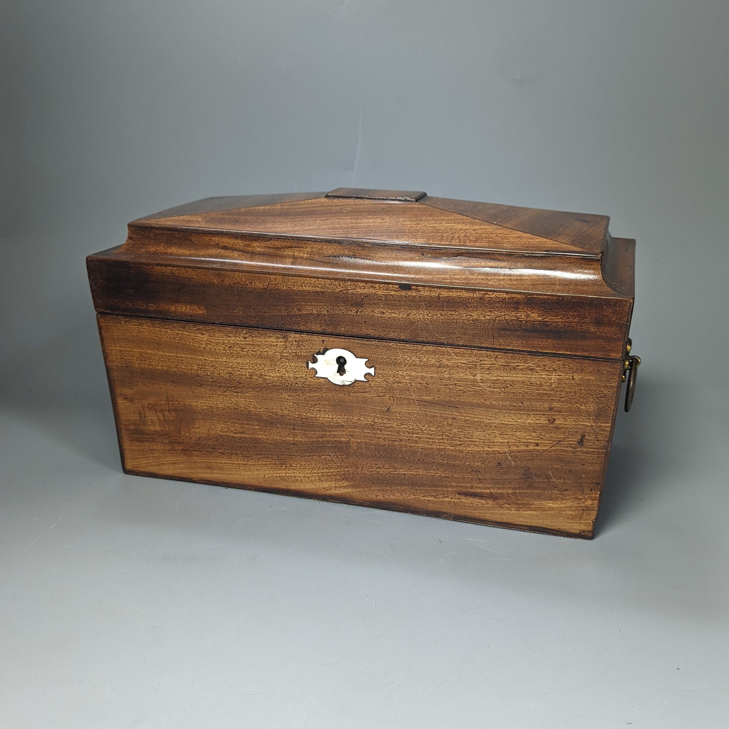 A 19th century mahogany tea caddy and a walnut 2 door smokers cabinet, Smokers cabinet 33 cms high.